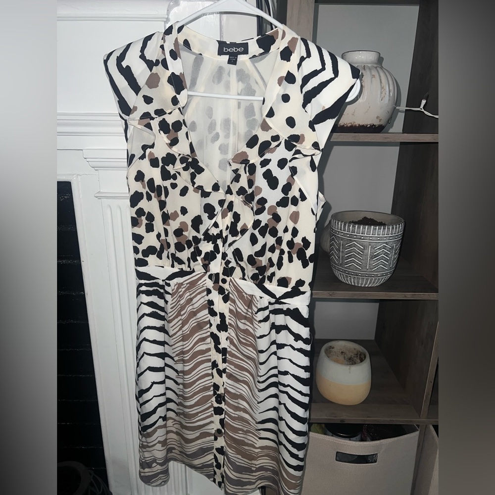 Bebe, size small, shoulder pads, above knee, like new